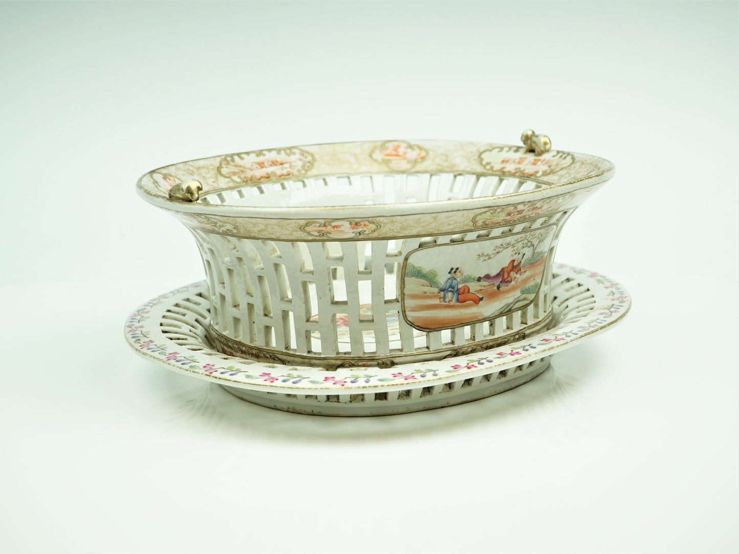 A Chinese export porcelain reticulated chestnut basket on stand